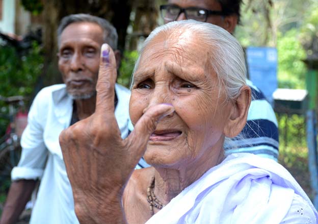 Elderly voters participate in the festival of democracy at Agartala on April 19